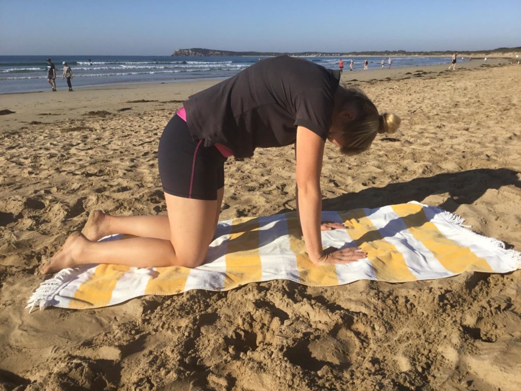 Mel demonstrates exercises on Ocean Grove