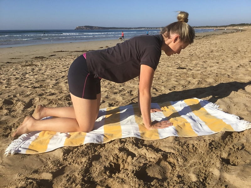 Mel demonstrates exercises on Ocean Grove